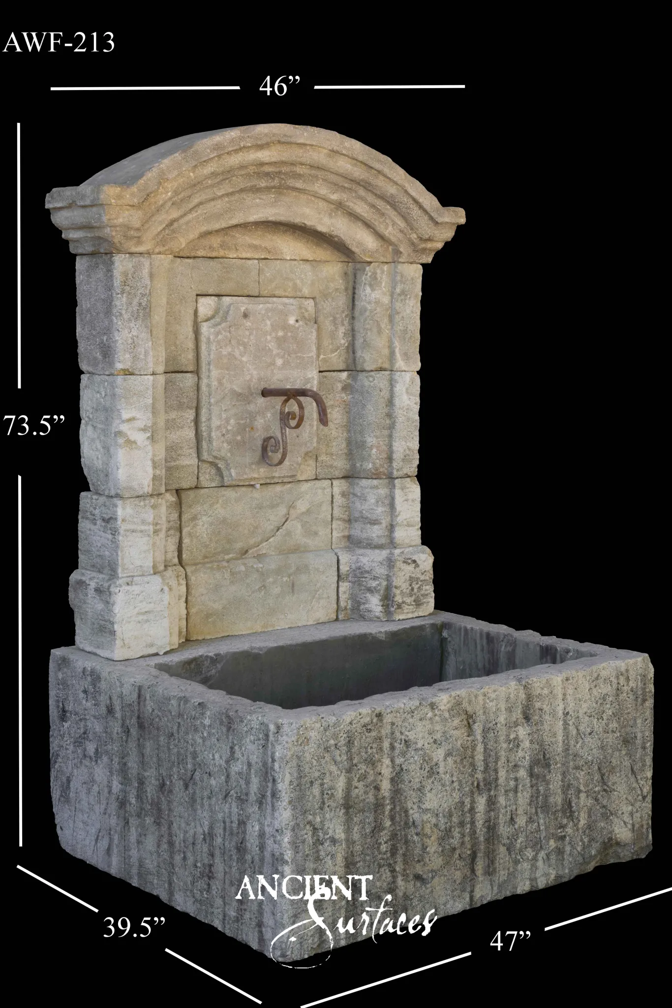 Reclaimed antique limestone wall fountain from Ancient Surfaces with a segmental cornice, rusticated quoin piers, a raised moulded centre panel with an iron scroll spout and a massive grey monolithic trough combed with vertical chisel marks