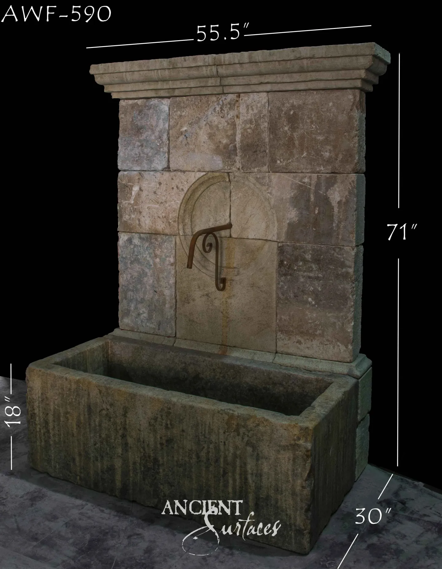 Reclaimed antique limestone wall fountain from Ancient Surfaces with a stepped cornice over a coursed ashlar backplate in pink, grey and buff, a carved roundel holding a large iron scroll spout and a long trough mossed green